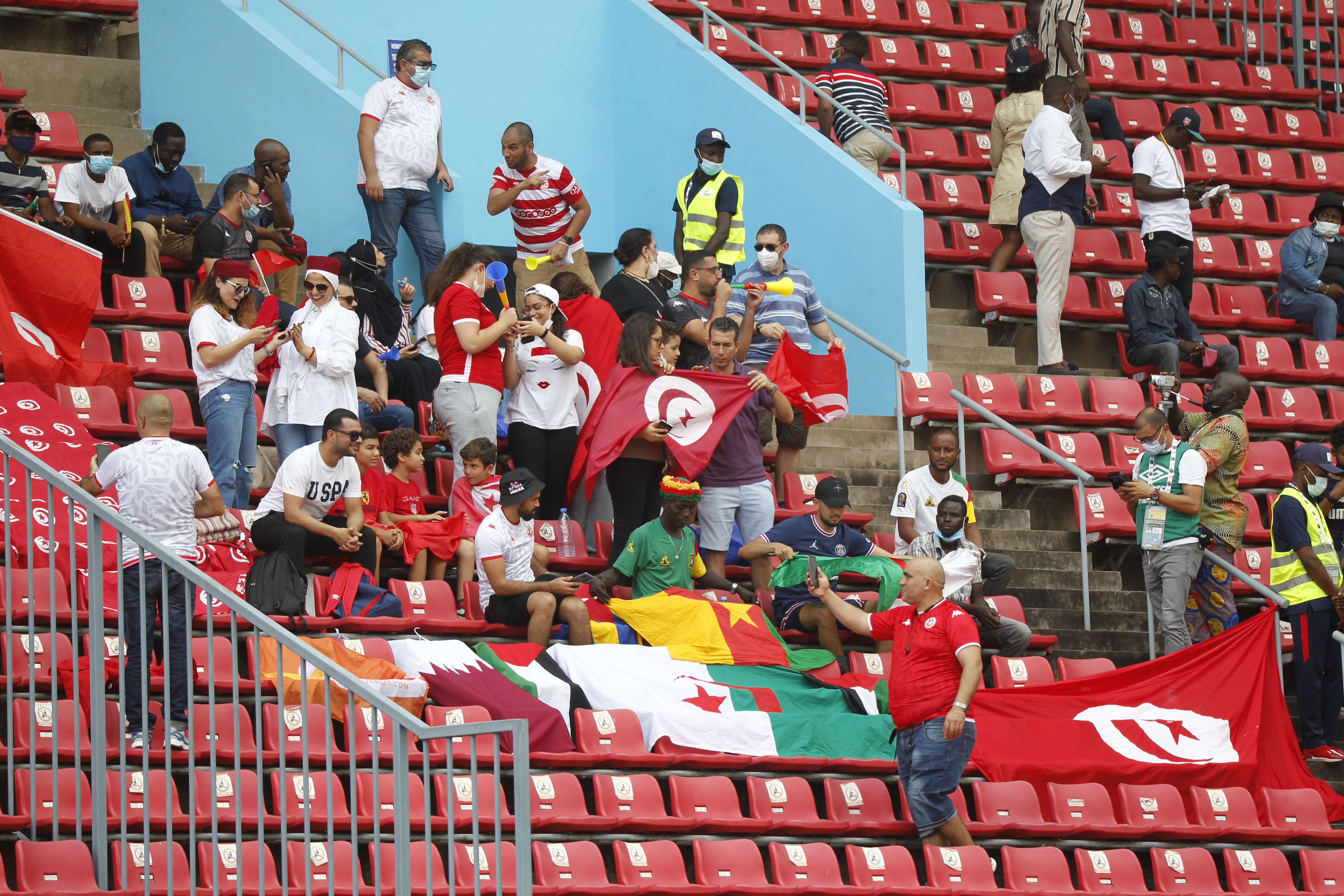 Tunisia supporters in red and white before an international football match