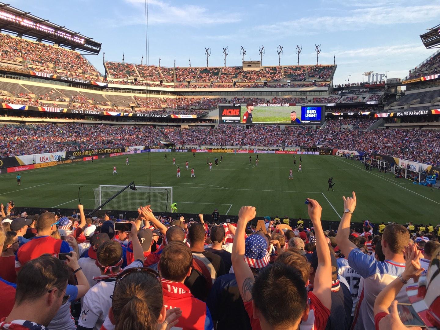 Match action and crowd scene from a United States vs Paraguay international fixture